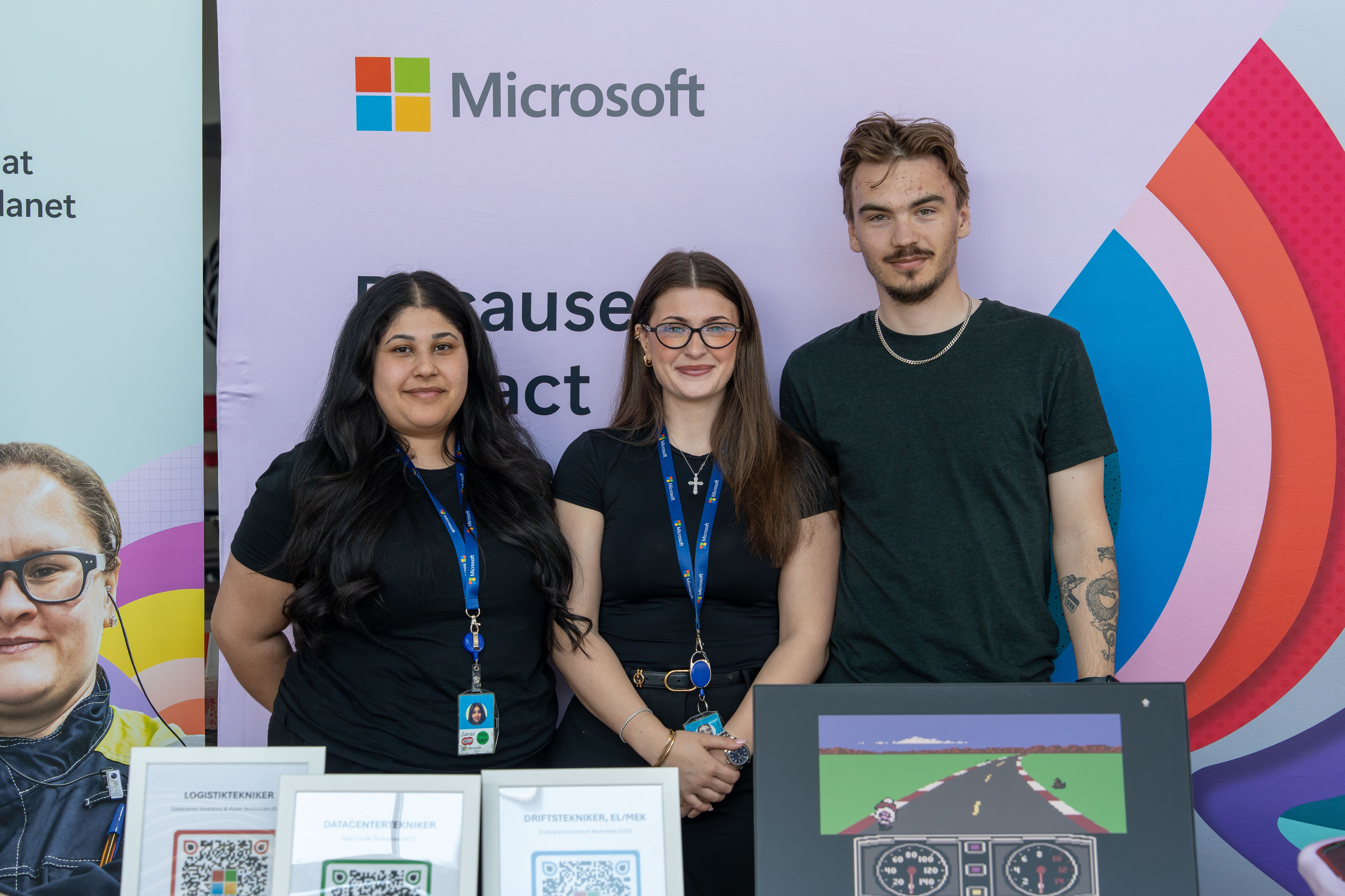 Image of musician and organizer on stage with Microsoft Logo in the background